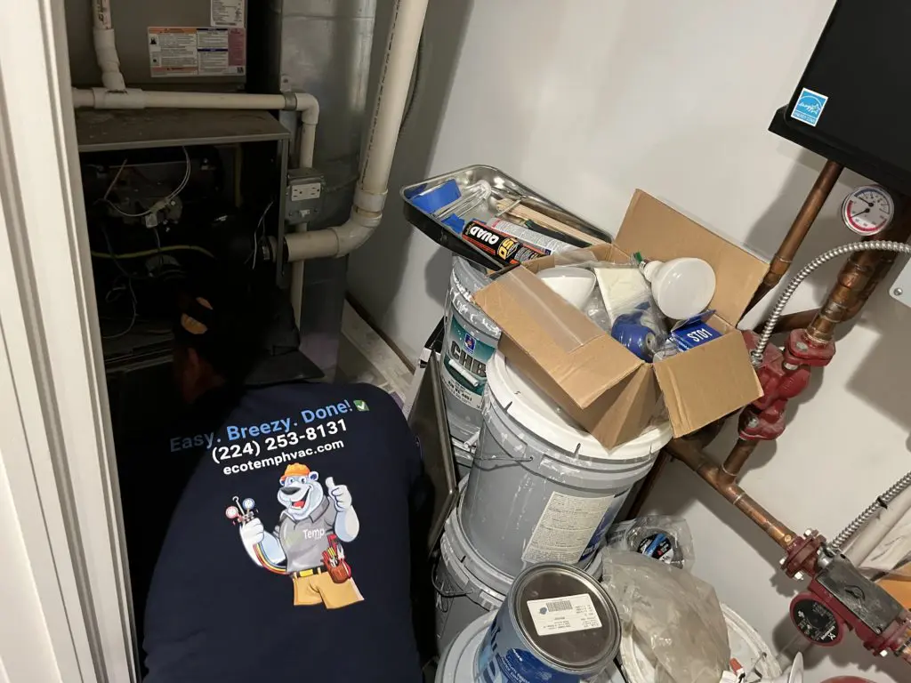 HVAC technician repairing a broken furnace in Burr Ridge IL