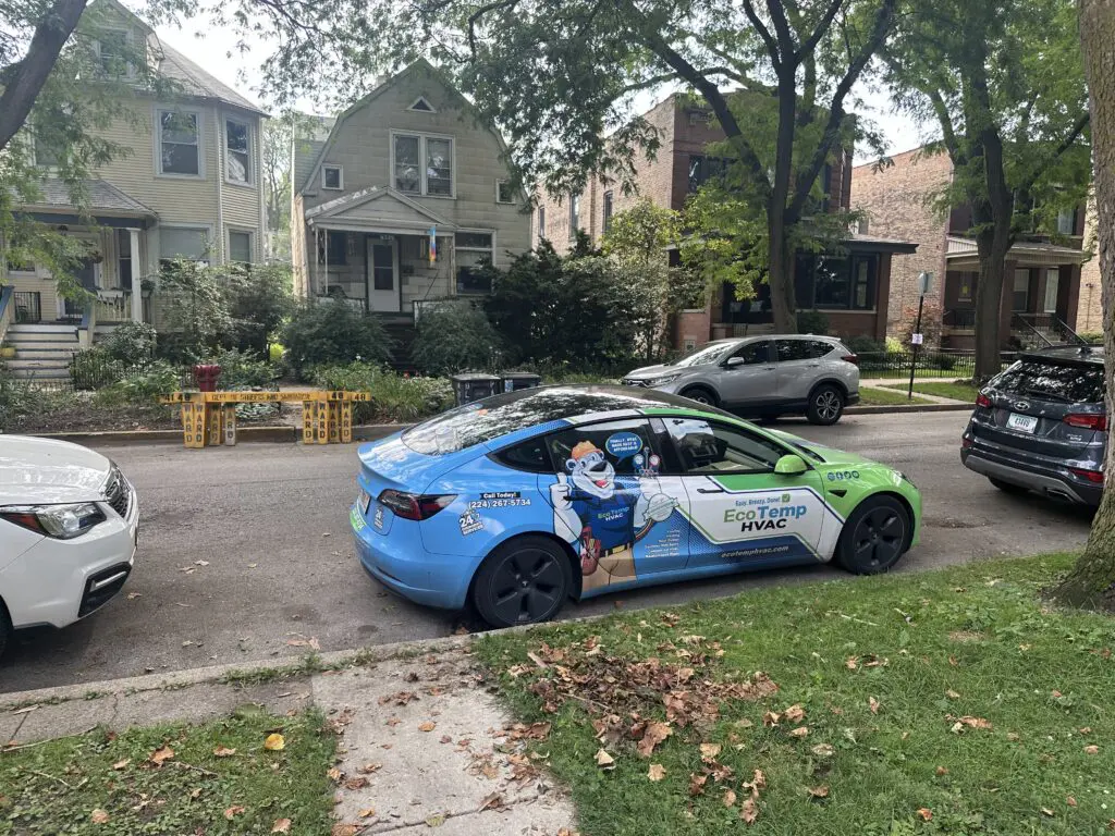Eco Temp HVAC service vehicle parked outside a Hampshire home promoting professional air conditioning installation services.